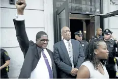  ?? MATT ROURKE/THE ASSOCIATED PRESS ?? Andrew Wyatt raises his fist as Bill Cosby exits the Montgomery County Courthouse after a mistrial was declared in Norristown, Pa., on Saturday.