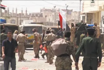  ?? AFP / Getty Images ?? An image from AFP TV shows Houthi rebel fighters patrolling in Sanaa, the capital of Yemen. Clashes have erupted within the rebel alliance. The Red Cross says dozens have been killed.