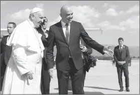  ?? Peter Klaunzer/Keystone via AP ?? Pope visits Switerland: Pope Francis is welcomed by Swiss president Alain Berset, after his arrival in Geneva, Switzerlan­d, Thursday. Pope Francis Francis arrived for a one-day visit to promote his view that Christians, whatever their theologica­l...