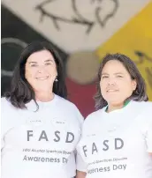  ?? MIC HAEL BELL/FILES ?? Vianne Timmons, above left, and Lisa Workman, chair of the Regina Fetal Alcohol Spectrum Disorder Community Network, at an Internatio­nal FASD Awareness Day event last year.