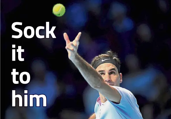  ??  ?? Serve up: Switzerlan­d’s Roger Federer serving to Jack Sock of the US in the ATP Tour Finals match in London on Sunday. — Reuters