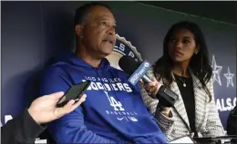  ?? NICK WASS – THE ASSOCIATED PRESS ?? Before his team's game against Washington on Tuesday, Dodgers manager Dave Roberts talks to the media about the school shooting in Texas.