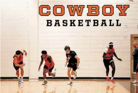  ?? [PHOTO BY MITCHELL ALCALA, FOR THE OKLAHOMAN] ?? Members of the Oklahoma State basketball team run sprints during practice on Sunday in Stillwater. The Cowboys are preparing for a tour of Europe, which includes a few games.