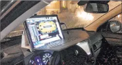  ?? Ryan Depaulo ?? New York resident Ryan Depaulo has his computer set up on the dashboard of his car in the parking lot of a Whole Foods in northern New Jersey on July 13.