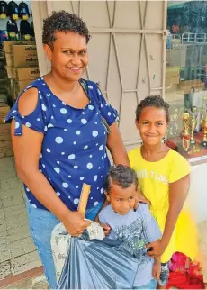  ?? Photo: Sampras Anand ?? Asilika Evans, 36, with her son Joshua Ligalevu, 4, and daughter, Hope Ligalevu, 9, recently shopped for back to school at the Janta Store in Labasa Town.