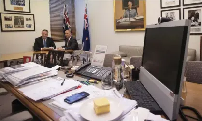  ?? Photograph: Mike Bowers/The Guardian ?? Josh Frydenberg with Mathias Cormann at a budget day photograph­ic opportunit­y in the treasurer’s office with the vanilla slice in the foreground.