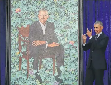  ?? — GETTY IMAGES ?? Former U.S. president Barack Obama stands next to his newly unveiled portrait at the Smithsonia­n’s National Portrait Gallery on Monday in Washington, D.C.