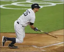  ?? ADAM HUNGER ?? New York Yankees’ DJ Lemahieu hits an RBI single during the second inning of a baseball game against the Toronto Blue Jays, in New York, Tuesday, Sept. 15, 2020. Lemahieu is a free agent.