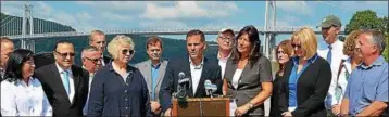  ?? MID-HUDSON NEWS NETWORK PHOTO ?? Elected officials joined Dutchess County Executive Marc Molinaro, at the podium, on Monday, Sept. 18, 2017, to call for a clean Hudson River at a press conference in Poughkeeps­ie, N.Y.