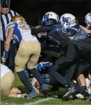  ?? PHOTO/ROBERT KRIZMANICH ?? At the bottom of this pile is Laville’s Owen Smith scoring against North Judson. The Lancers are the only team to defeat the Bluejays this season.