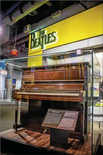  ??  ?? John Lennon and Paul McCartney used this Archibald Ramsden upright piano to write some of The Beatles’ iconic songs. It’s now on display at the Rock & Roll Hall of Fame.