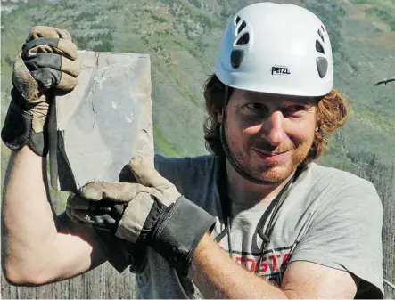  ?? Dr. Jean-Bernard Caron ?? Michael Streng holds a newly discovered fossil at a significan­t shale fossil bed in Kootenay National Park near Marble Canyon.