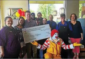  ?? SUBMITTED PHOTOS ?? Ronald McDonald House Charities Scholarshi­p recipient winner Henry Hoffman poses with his family, Ronald McDonald, and the staff and crew of the Dresher McDonald’s.