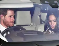  ??  ?? Driving Miss Markle: Harry with his fiancee