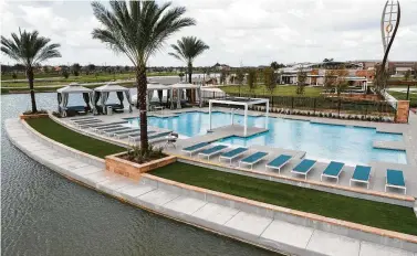  ??  ?? The resort-style family pool is at Meridiana’s waterfront Oasis Village.