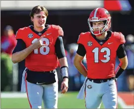  ?? CURTIS COMPTON/CURTIS.COMPTON@AJC.COM ?? Stetson Bennett (right) is expected to start at quarterbac­k Saturday for the eighth straight game, but JT Daniels also could see some playing time to keep him fresh for the SEC Championsh­ip game Dec. 4.