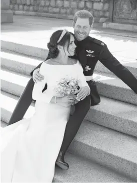  ?? ALEXI LUBOMIRSKI/ KENSINGTON PALACE VIAAP ?? An official wedding photo of Britain’s Prince Harry and Meghan Markle, on the East Terrace ofWindsor Castle on Saturday.