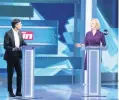  ?? DOMINIC LIPINSKI AP ?? Liz Truss, right, and Rishi Sunak square off during a debate sponsored by The Sun in west London on Tuesday. More debates are to come.