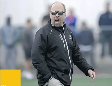  ?? JUSTIN TANG/ OTTAWA CITIZEN ?? General manager Marcel Desjardins rallies prospectiv­e athletes at the start of an open tryout camp for free-agent CFL players vying for a spot on the Redblacks at Carleton University’s Keith Harris Stadium.