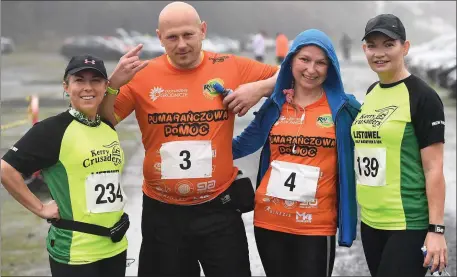  ??  ?? Pictured at a very wet start of the Listowel 10k and half-marathon, which started from Listiwel Racecourse, last Saturday were Bogna Kuieszewic­z from Causeway , Michal and Agata Bardusiak from Daugh and Tracy Moriarty from Listowel. Photo by Domnick...