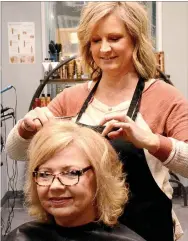  ?? Janelle Jessen/Herald-Leader ?? Christy Osbourn styles the hair of Doris Osbourn Warford of Springdale. Christy recently opened Urban Edge Salon, which offers the first salon suite business in Siloam Springs.