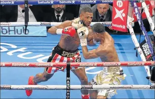  ?? Picture: GETTY IMAGES ?? BLOW BY BLOW: IBF welterweig­ht world title boxing Kell Brook, left, exchanges blows with Errol Spence Jr. Brook was stopped by Spence to lose the IBF world welterweig­ht title at Bramall Lane