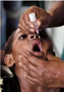  ??  ?? Warapnong Ponde, 6, recieves a polio vaccinatio­n in Papua New Guinea. — AFP