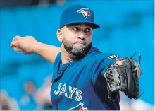  ?? FRED THORNHILL THE CANADIAN PRESS ?? Designated hitter Kendrys Morales pitches against the A’s on Sunday.