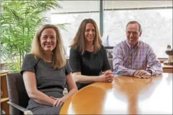  ?? RICK KAUFFMAN — DIGITAL FIRST MEDIA ?? Jennifer McKee, left, Kate Black, center, and Frank McKee, right, of the McKee Group, a well-known real estate group out of Springfiel­d, will apply for a permit to establish a medical marijuana grower-processer company in Aston.