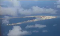  ?? (Francis Malasig/Reuters) ?? AN AERIAL VIEW of Spratly Islands in the South China Sea. In 2014, tension between Vietnam and China rose to its highest levels in decades when a Chinese oil rig started drilling in Vietnamese waters.