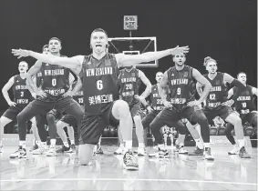  ?? MARK KOLBE GETTY IMAGES ?? Tom Abercrombi­e of the New Zealand Tall Blacks is rejected during an exhibition game against Canada in Sydney, Australia, on Tuesday. The haka didn’t help, as Canada won, 122-88.