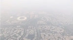  ?? REUTERS ?? The New Delhi skyline is shrouded in smog in early December last year. The Indian capital has been named the most polluted city in the world for a second year straight.