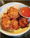  ?? WENDELL BROCK FOR THE AJC ?? Corn fritters, made with red curry and lime leaf and served with a sweet-chili dipping sauce, are among popular items at Jackalope, which is popup-in-residence at Dead End Drinks.