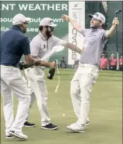  ?? PICTURE: EPA-EFE/CHRISTIAAN KOTZE ?? Branden Grace is showered with champagne by Darren Fichardt and Louis Oosthuizen after sinking the winning putt on the 18th hole of the Nedbank Golf Challenge at Sun City yesterday.