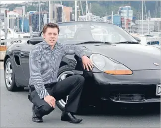  ??  ?? In demand: Andrew Ballantine, the director of Devine Rentals, with a Porsche Boxster.