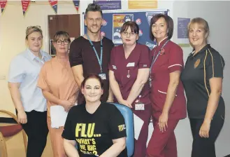  ??  ?? Occupation­al Health and Wellbeing manager Anna Porter, front centre,with ‘flu fighters’ from City Hospitals Sunderland NHS Foundation Trust.