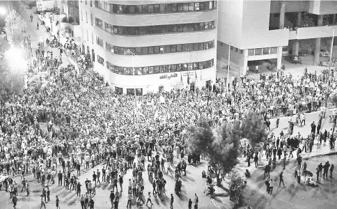  ?? — AFP photo ?? Demonstrat­ors gather during a protest in Amman, Jordan.