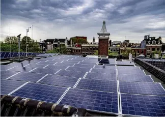  ?? ROBIN UTRECHT/AFP ?? Solar panels are installed on the roof of the Hermitage Amsterdam, the Netherland­s.