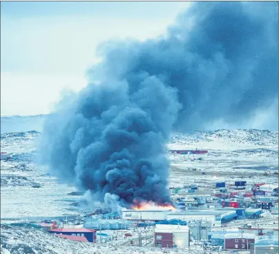 ?? CP PHOTO ?? A fire burns at a Northmart store in Iqaluit, Nunavut on Thursday.