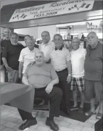  ?? PHOTO COURTESY OF JOE KAROLYI ?? Racalmuto Club members gather around Angelo Mosca (seated). From left: Paul Rome, Sam Agro, Lib Mendola, Charlie Brucculeri, Joe Ricottone, Mike Speziale, Joe Garlisi and Gus Maniaci.