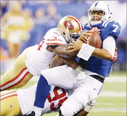  ??  ?? Indianapol­is Colts quarterbac­k Jacoby Brissett (7) is sacked by San Francisco 49ers’ DeForest Buckner (99) and Elvis Dumervil (58) during the
second half of an NFL football game on Oct 8 in Indianapol­is. (AP)