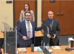  ?? Associated Press ?? Defense attorney Eric Nelson, left, and former Minneapoli­s police officer Derek Chauvin introduce themselves to potential jurors Tuesday in Minneapoli­s.