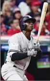  ?? The Associated Press ?? New York Yankees’ Didi Gregorius watches his two-run home run off Cleveland Indians starting pitcher Corey Kluber during the third inning of Game 5 of the American League Division Series Wednesday in Cleveland.