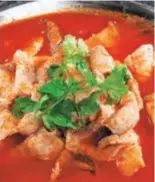  ??  ?? Guizhou-style sour soup fish in red soup made of tomatoes.