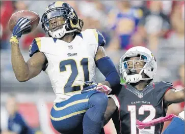  ?? Rick Scuteri
Associated Press ?? CORNERBACK JANORIS JENKINS, intercepti­ng a pass intended for John Brown ( 12) of the Arizona Cardinals in October, is an unrestrict­ed free agent the Rams are interested in re- signing.