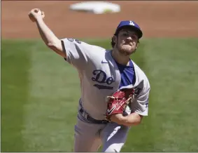  ?? JEFF CHIU - THE ASSOCIATED PRESS ?? Los Angeles Dodgers pitcher Trevor Bauer throws against the Oakland Athletics during the first inning of a baseball game in Oakland, Calif., Wednesday, April 7, 2021.