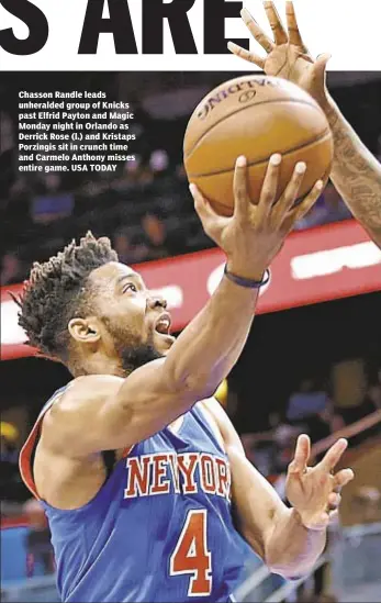  ??  ?? Chasson Randle leads unheralded group of Knicks past Elfrid Payton and Magic Monday night in Orlando as Derrick Rose (l.) and Kristaps Porzingis sit in crunch time and Carmelo Anthony misses entire game. USA TODAY