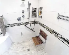  ?? Courtesy of Legal Eagle Contractor­s ?? The shower in this bathroom remodel features many aging-in-place products.