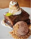  ??  ?? Among dessert offerings is a fudge brownie with candied hazlenut, marshmallo­w fluff and chocolate ice cream.