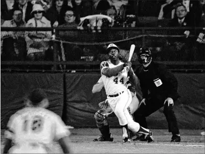  ?? Associated Press file ?? Hank Aaron, among those who died in 2020, watches the flight of his 715th home run against the Dodgers on April 8, 1974.